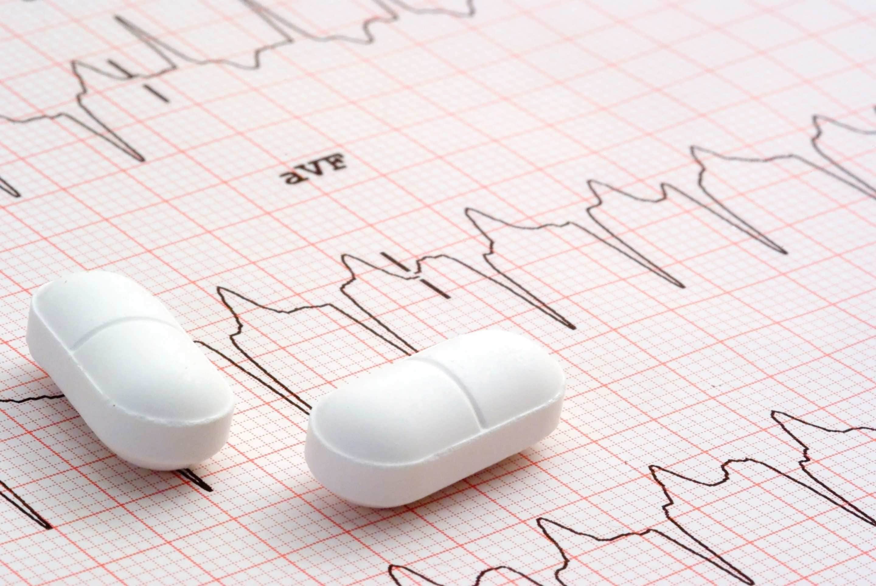 Image of cardiology graph and pharmaceutical pills