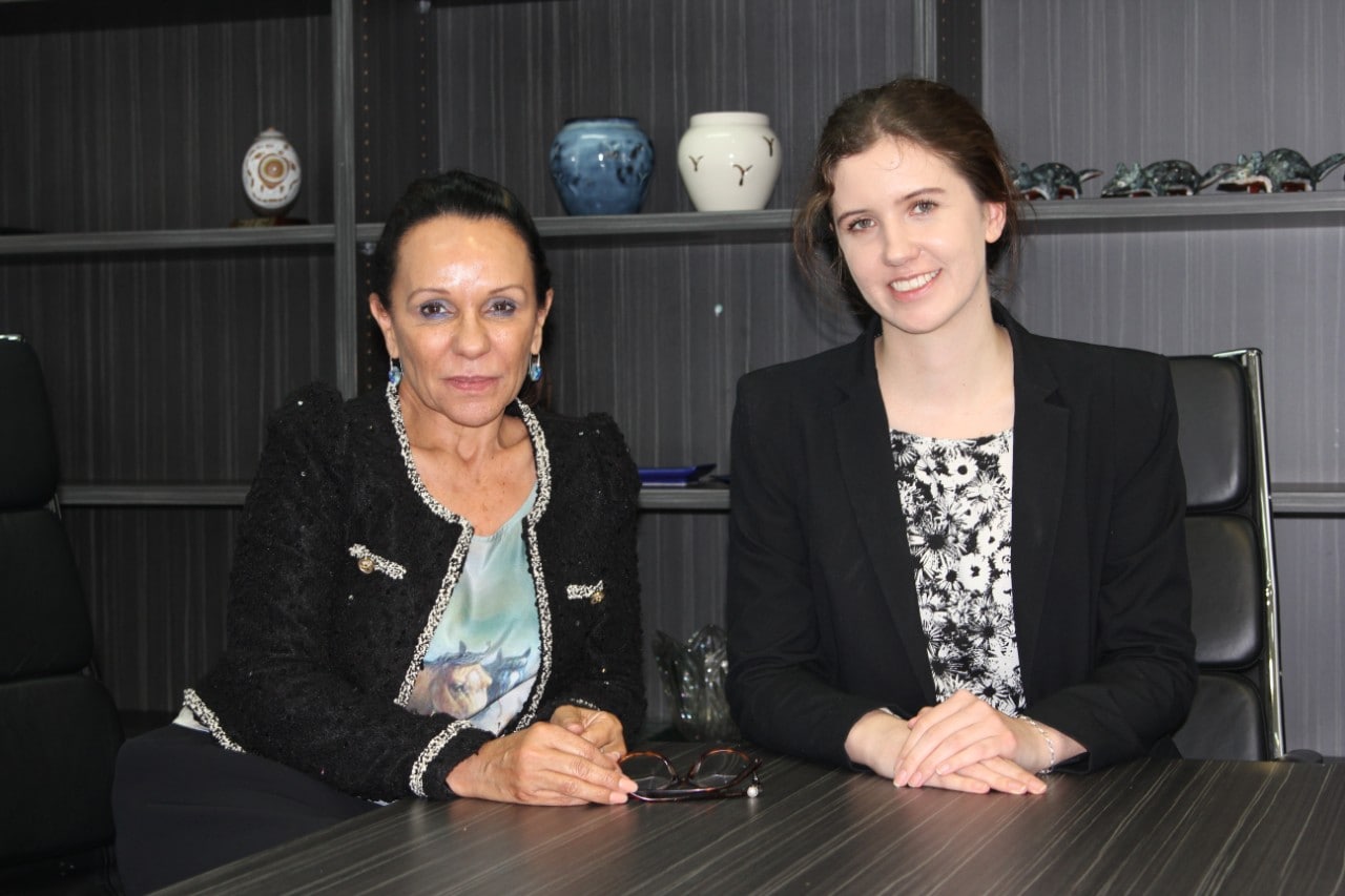 Federal politician Linda Burney poses for a photo with a student