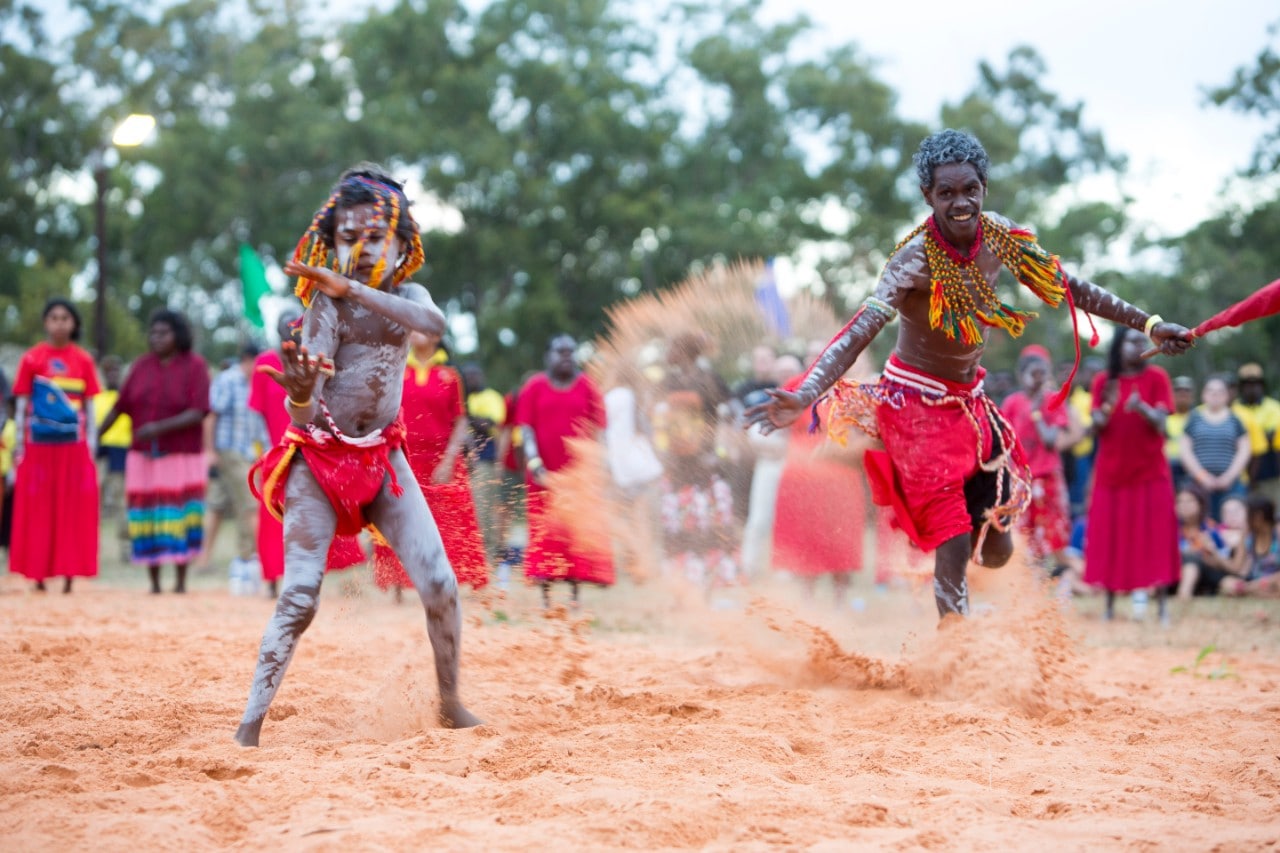 A photo of young Aboriginal people dancing in traditional dress.