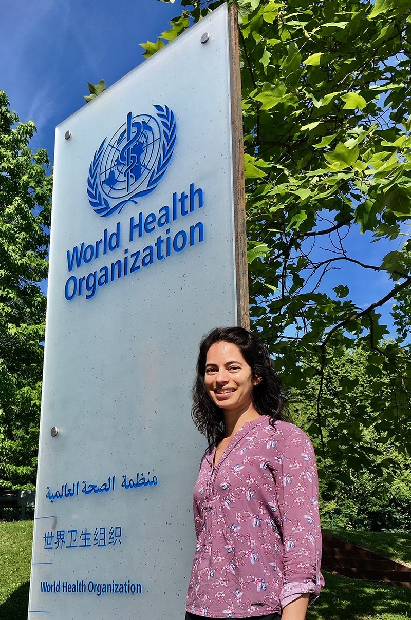 Anna Dean standing in front of the World Health Organization in Geneva