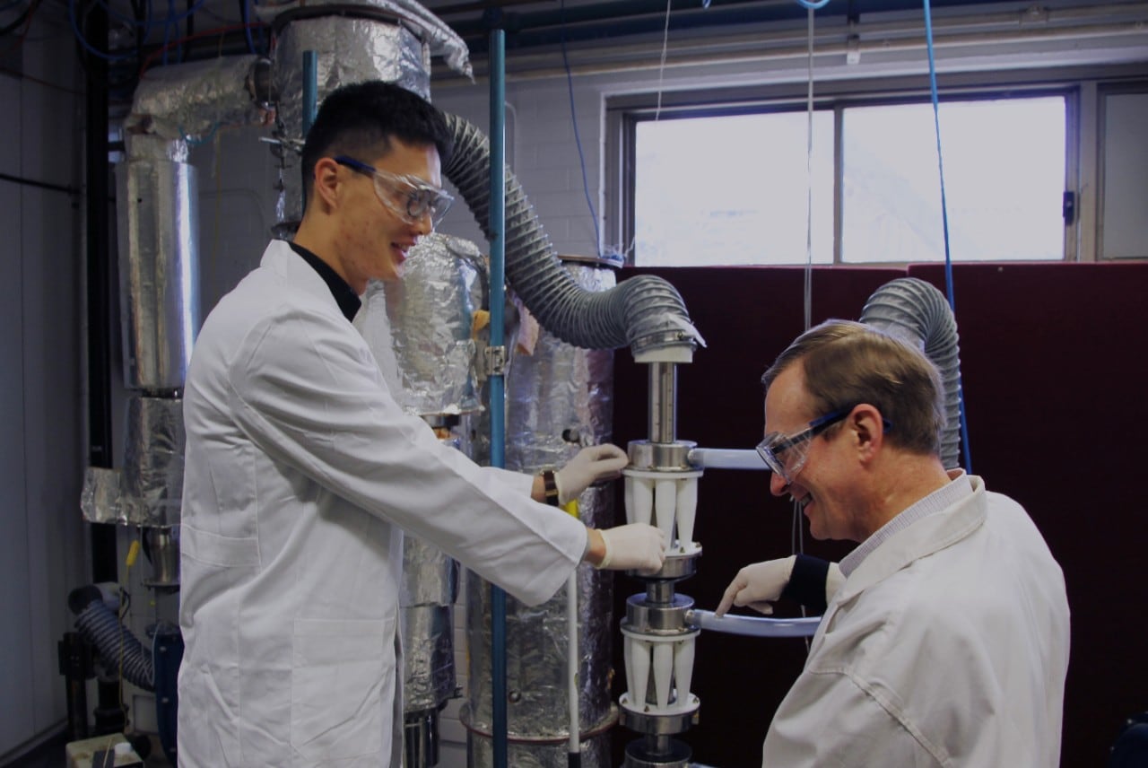 Professor Timothy Langrish and PhD candidate Harry Huang work on the new spray dryer.