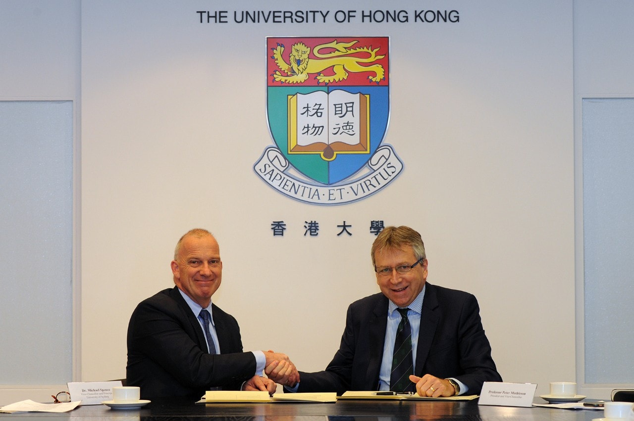 University of Sydney Vice-Chancellor and Principal Dr Michael Spence (left) and HKU President Professor Peter Mathieson sign the agreement. 