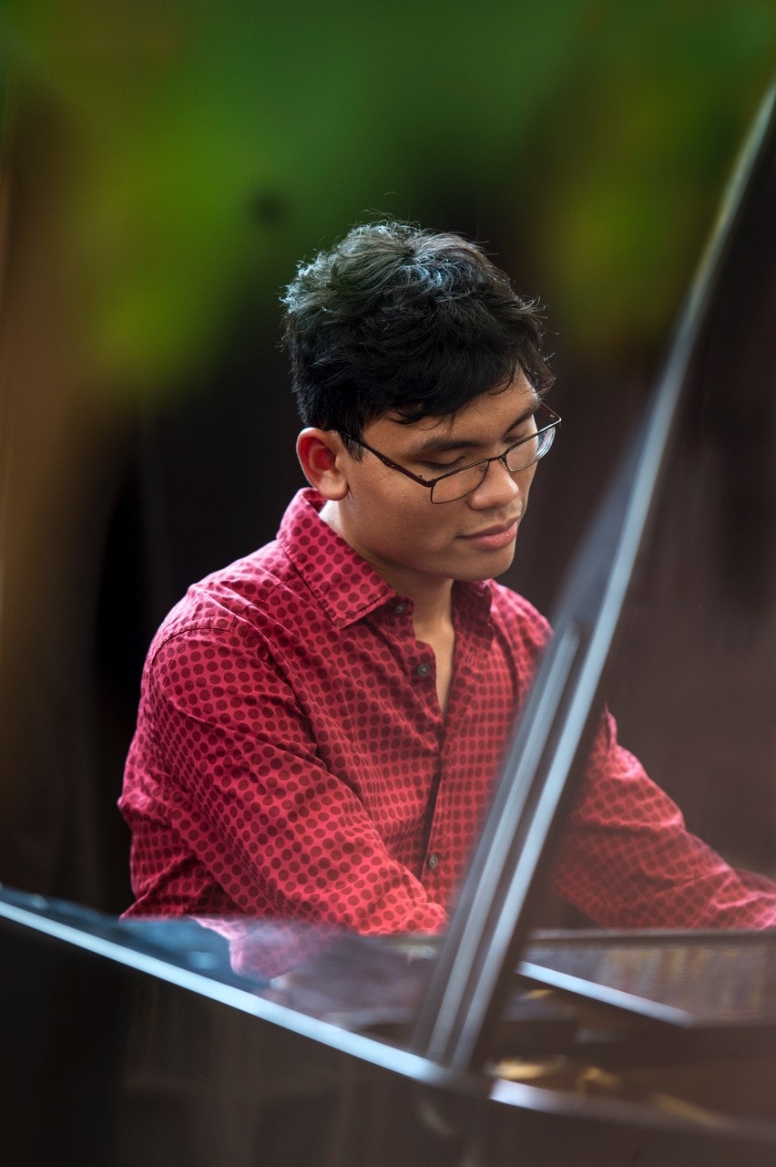 Calvin Abdiel playing piano