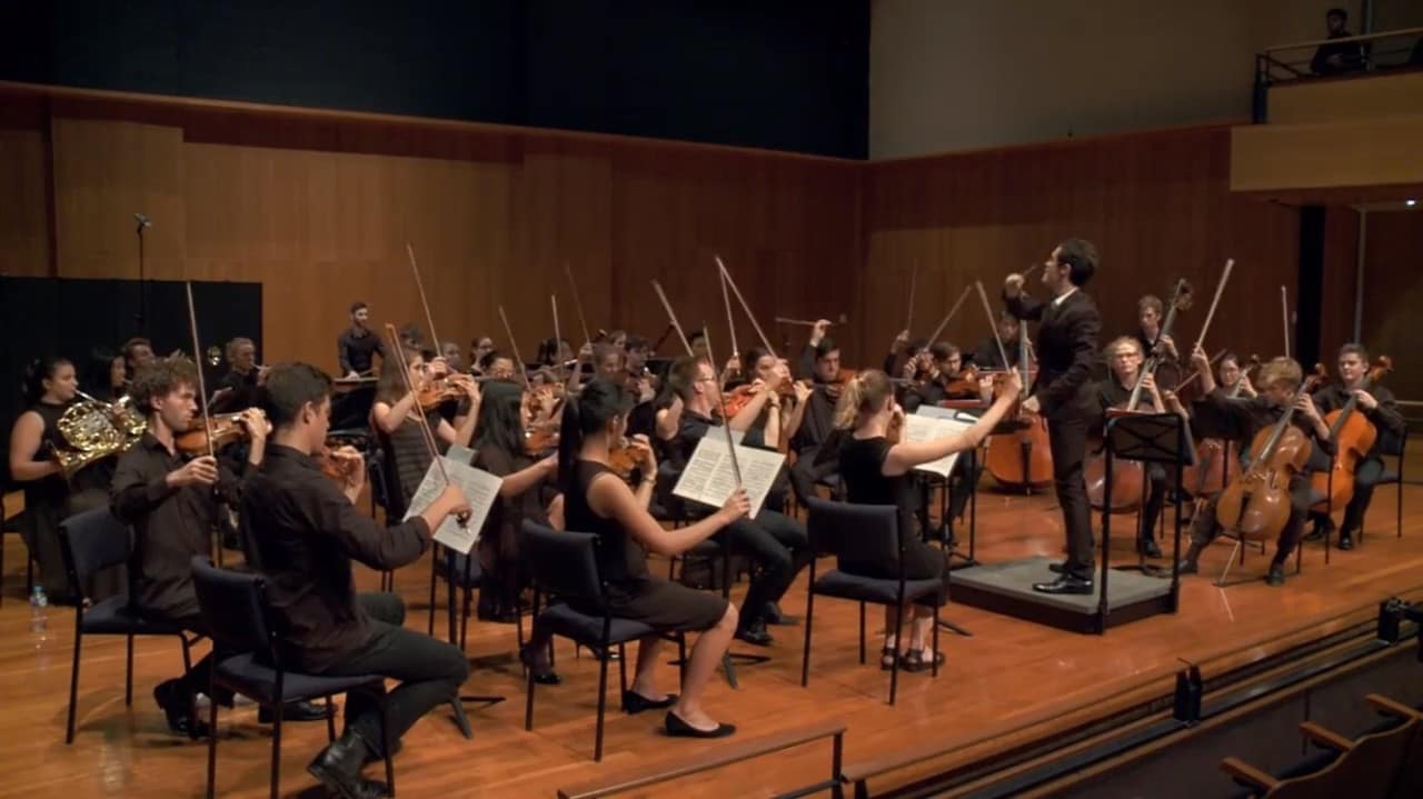 Sam Weller conducting an orchestra