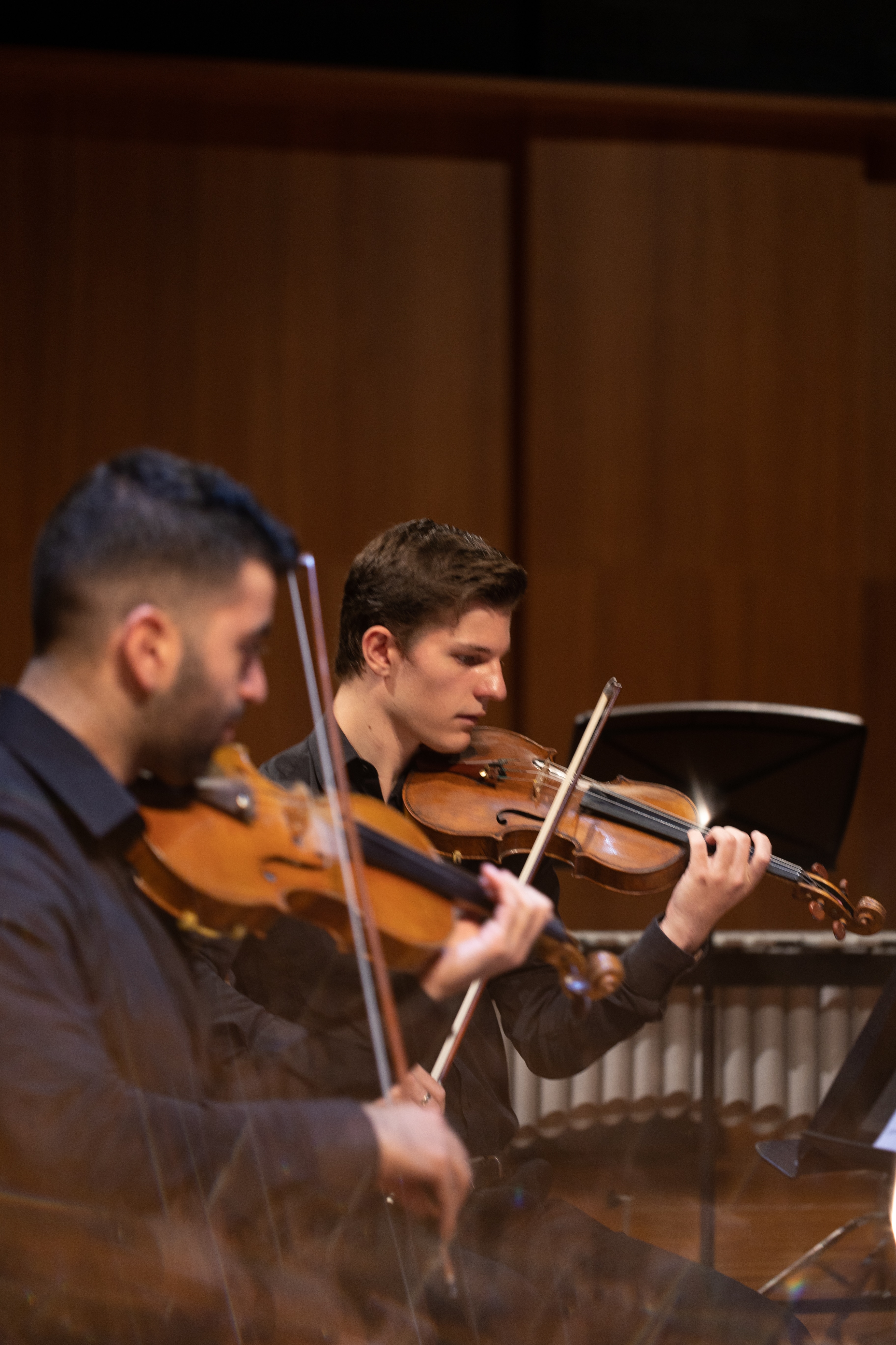 Male violinists at the rehearsal for composing women program 