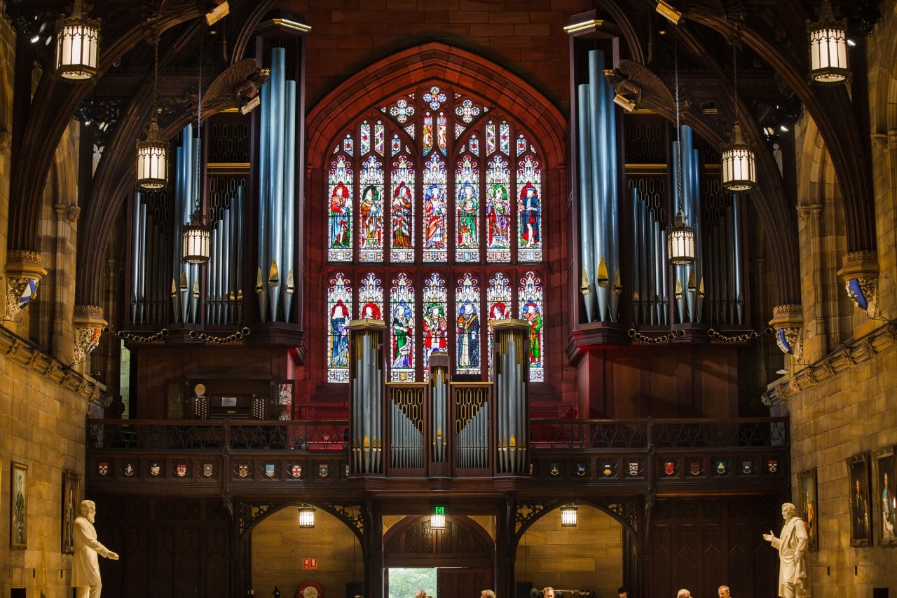 Illuminated stained glass windows in the University of Sydney's Great Hall