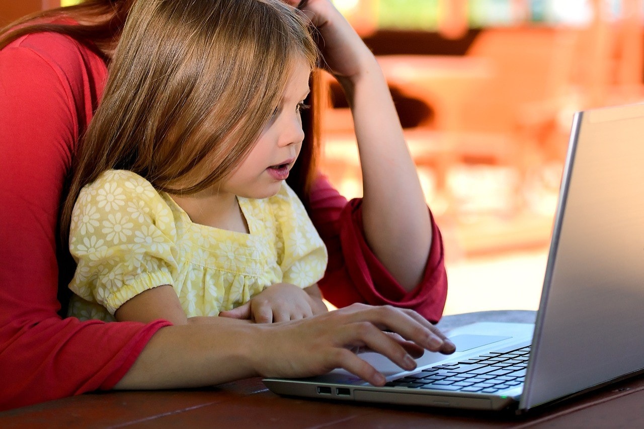 Mother and child at laptop