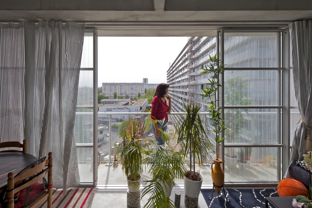 Resident standing in her apartment winter garden