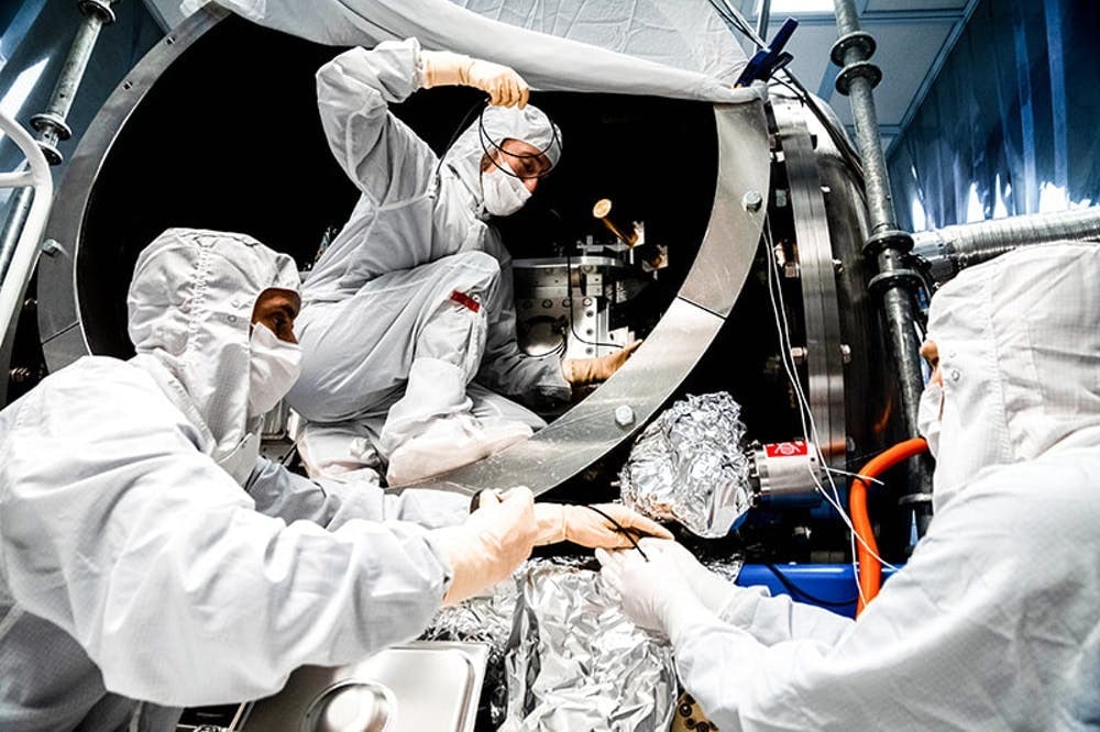 LIGO team members (left-to-right): Fabrice Matichard, Sheila Dwyer, Hugh Radkins) install in-vacuum equipment as part of the squeezed-light upgrade. Photo: Nutsinee Kijbunchoo/ANU