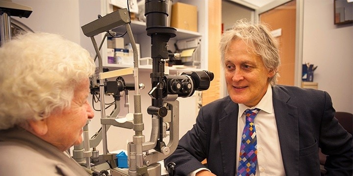 Professor Mark Gillies with a patient.