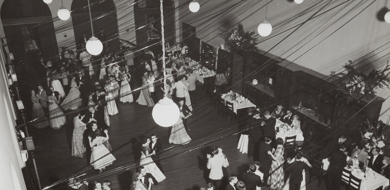 Sepia print of students dancing in a ballroom.