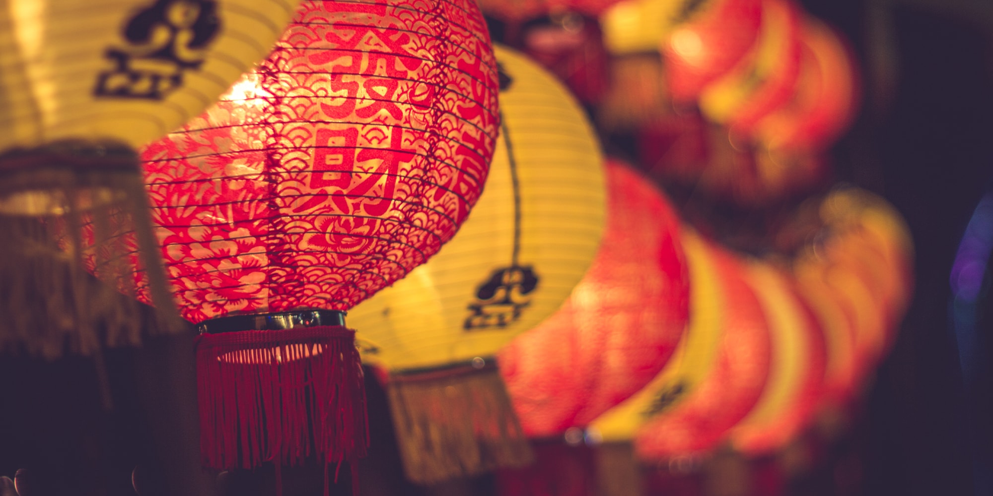 Chinese lamps are lined up in a bokeh composition