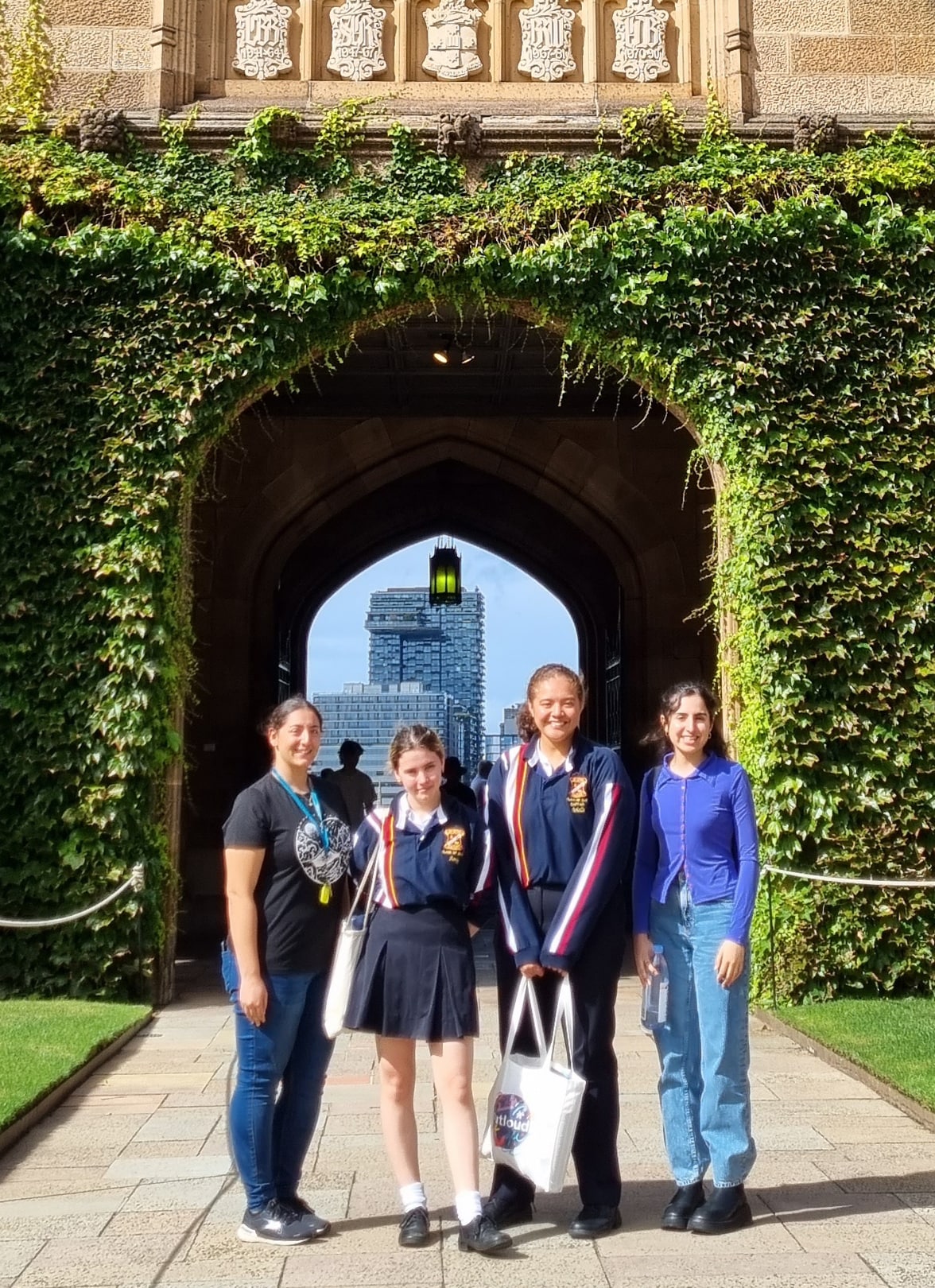 Ms Mona Baddah, History Teacher, and Arielle and Amy, Year 11 students from Birrong Girls High School, taking a photo with Gwen Dabaja, Program Mentor.