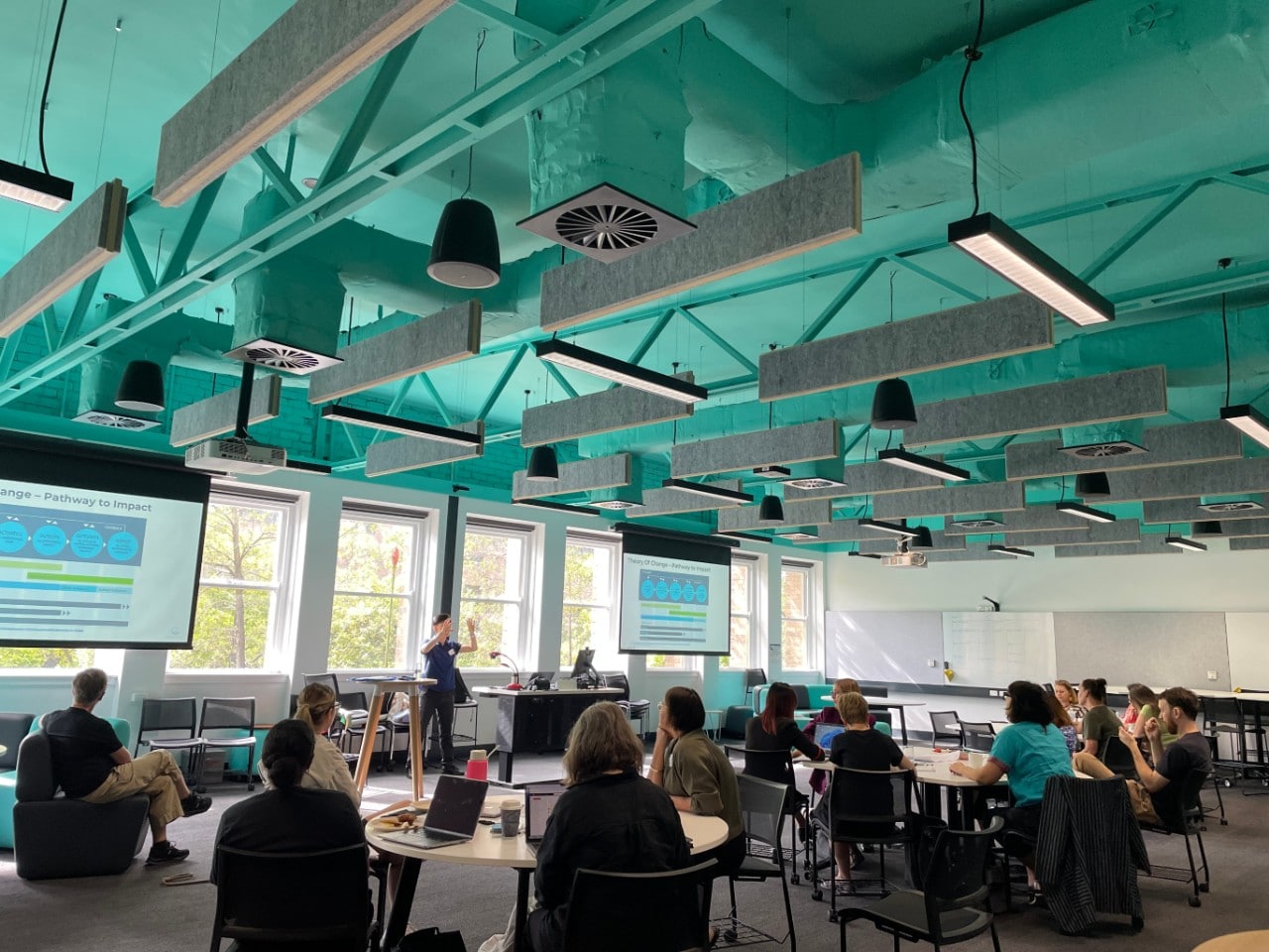 A group of researchers sitting in a room taking part in a workshop