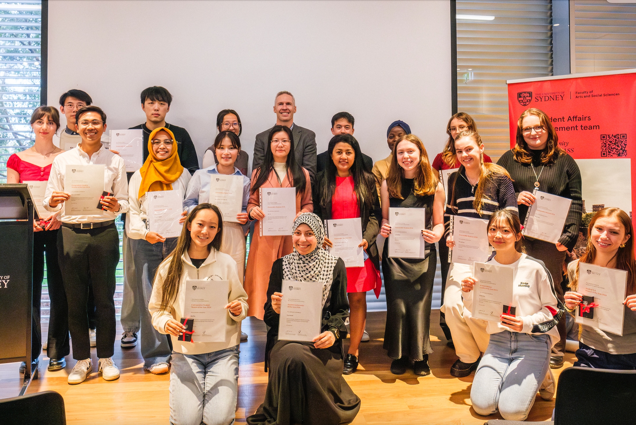 Group of students holding certificates