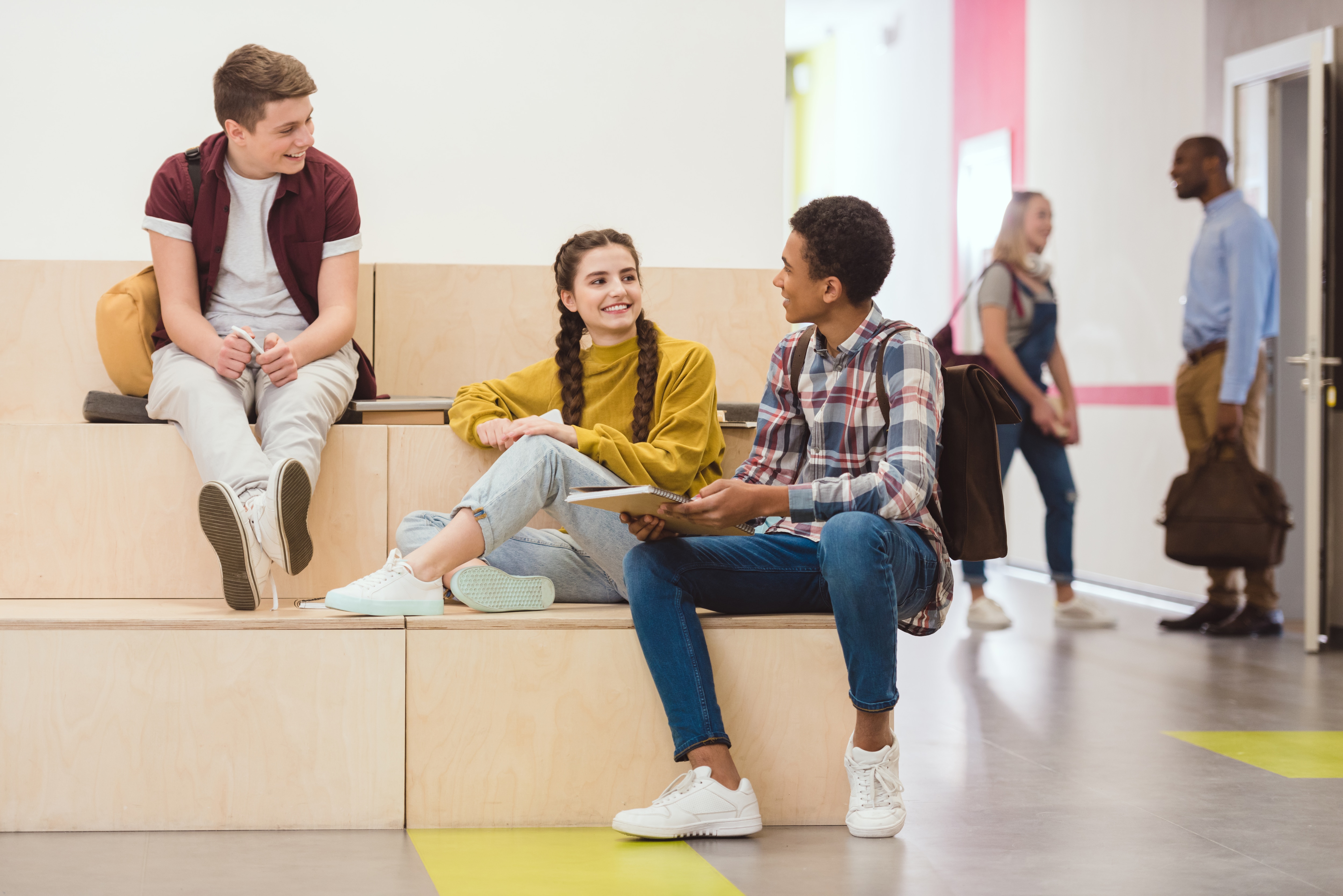 High school student sitting talking