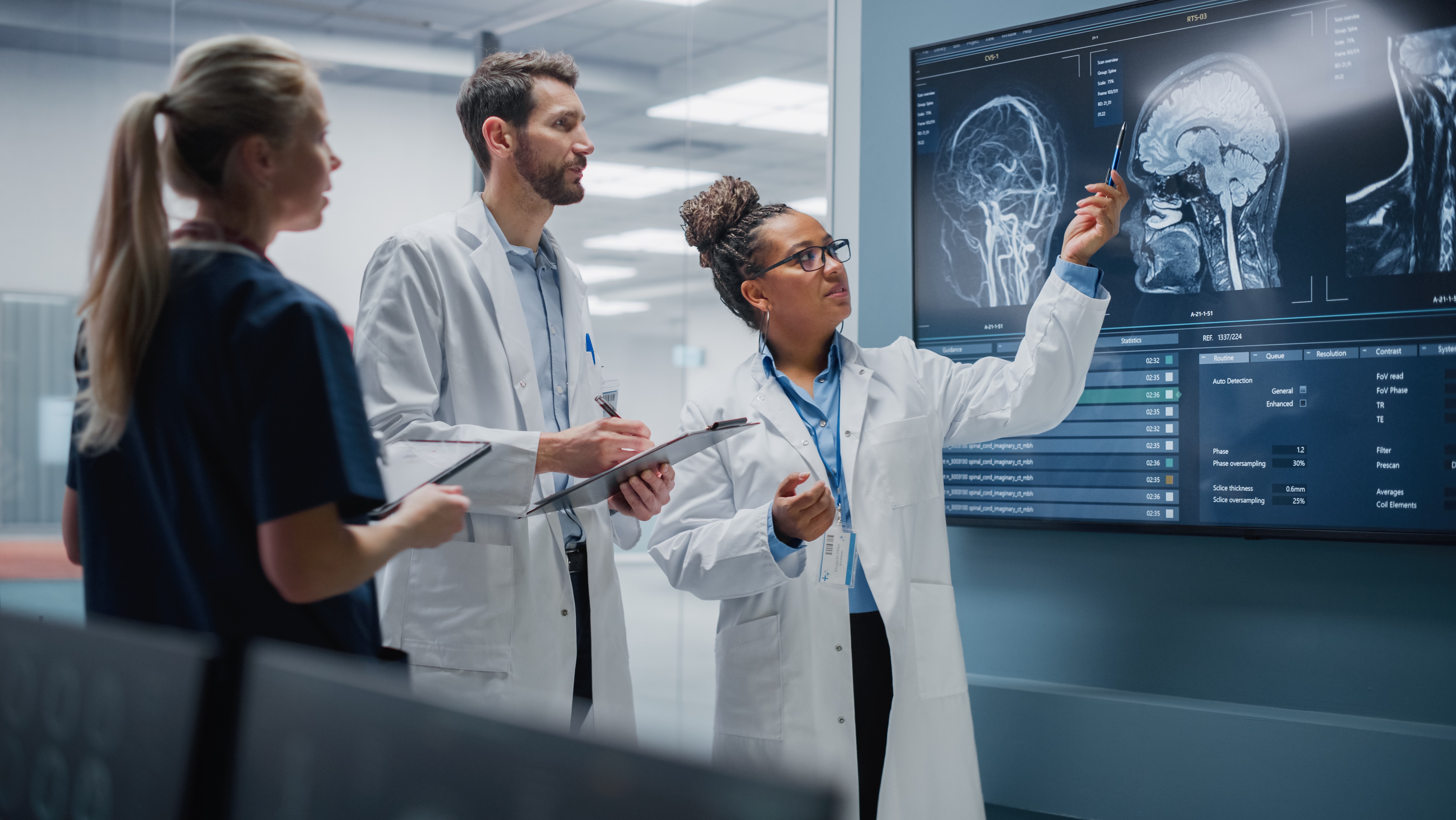 group of health professionals analysing brain scans