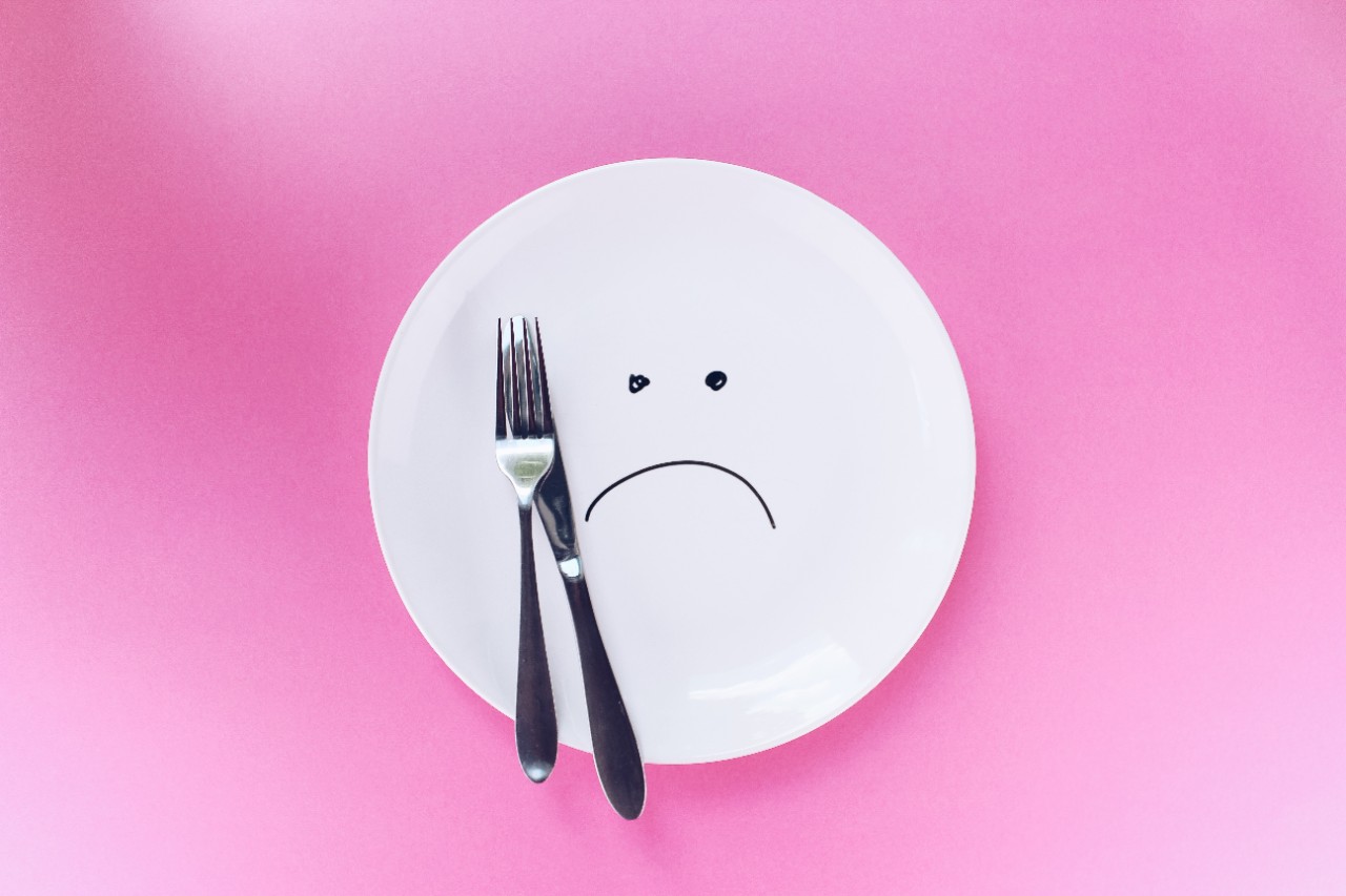 dinner plate with sad face
