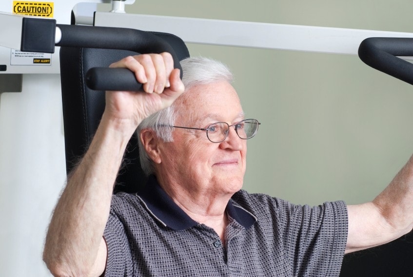 Older person doing weight training 