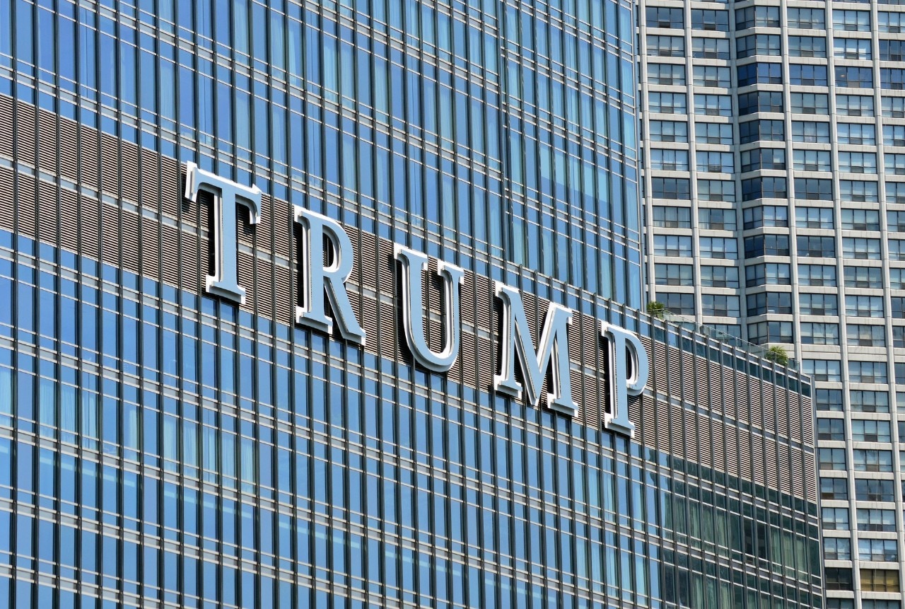 A sign on the side of a building reads 'Trump'.