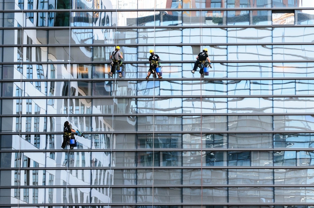 Window cleaners working on the exterior office window. 