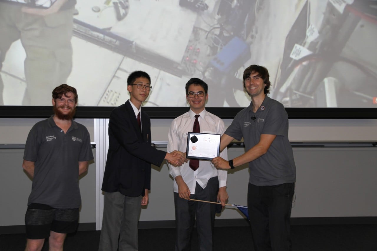 North Sydney Boys students with their mentor and Zero Robotics Coordinator Benjamin Morrell during plaque ceremony