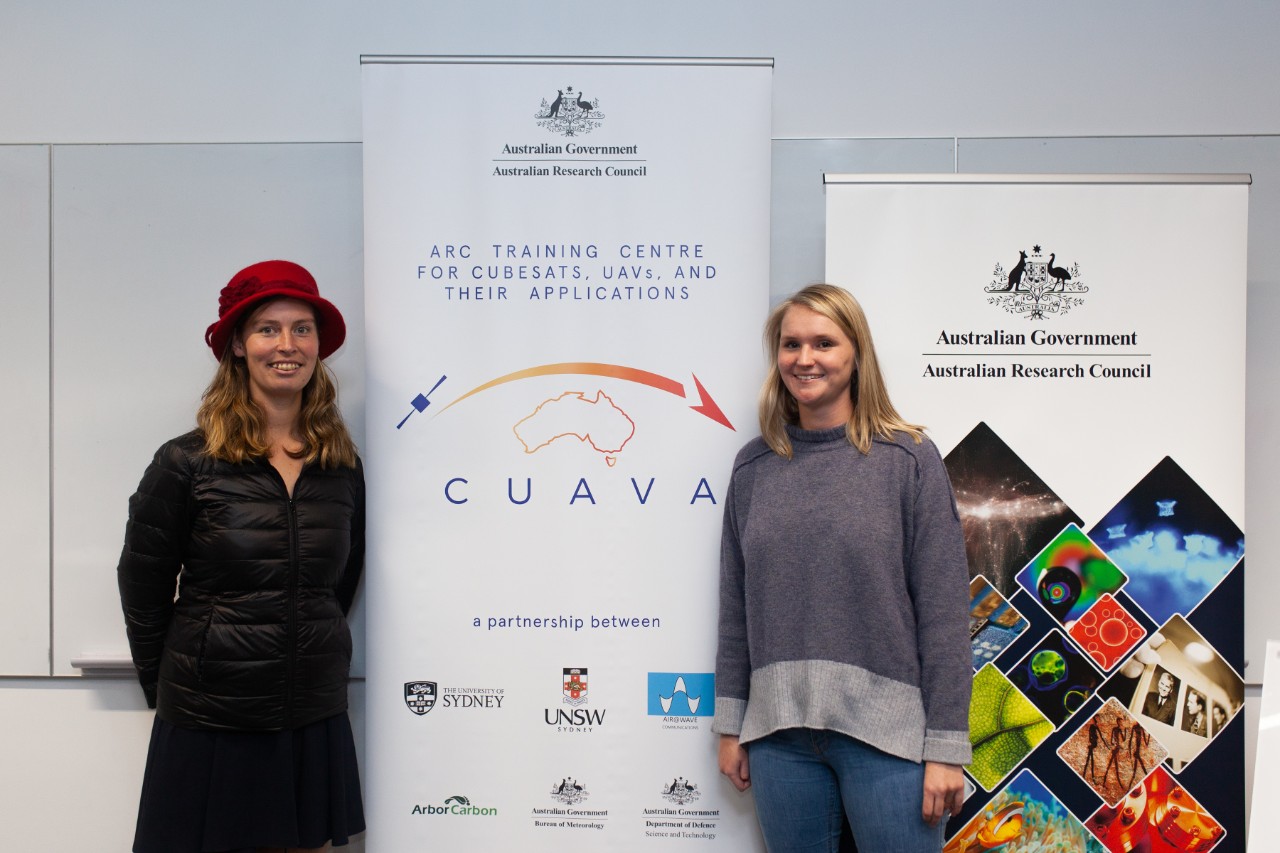 photo of two female PhD students at the CUAVA launch, Savannah McGuirk and Alexandra Jones