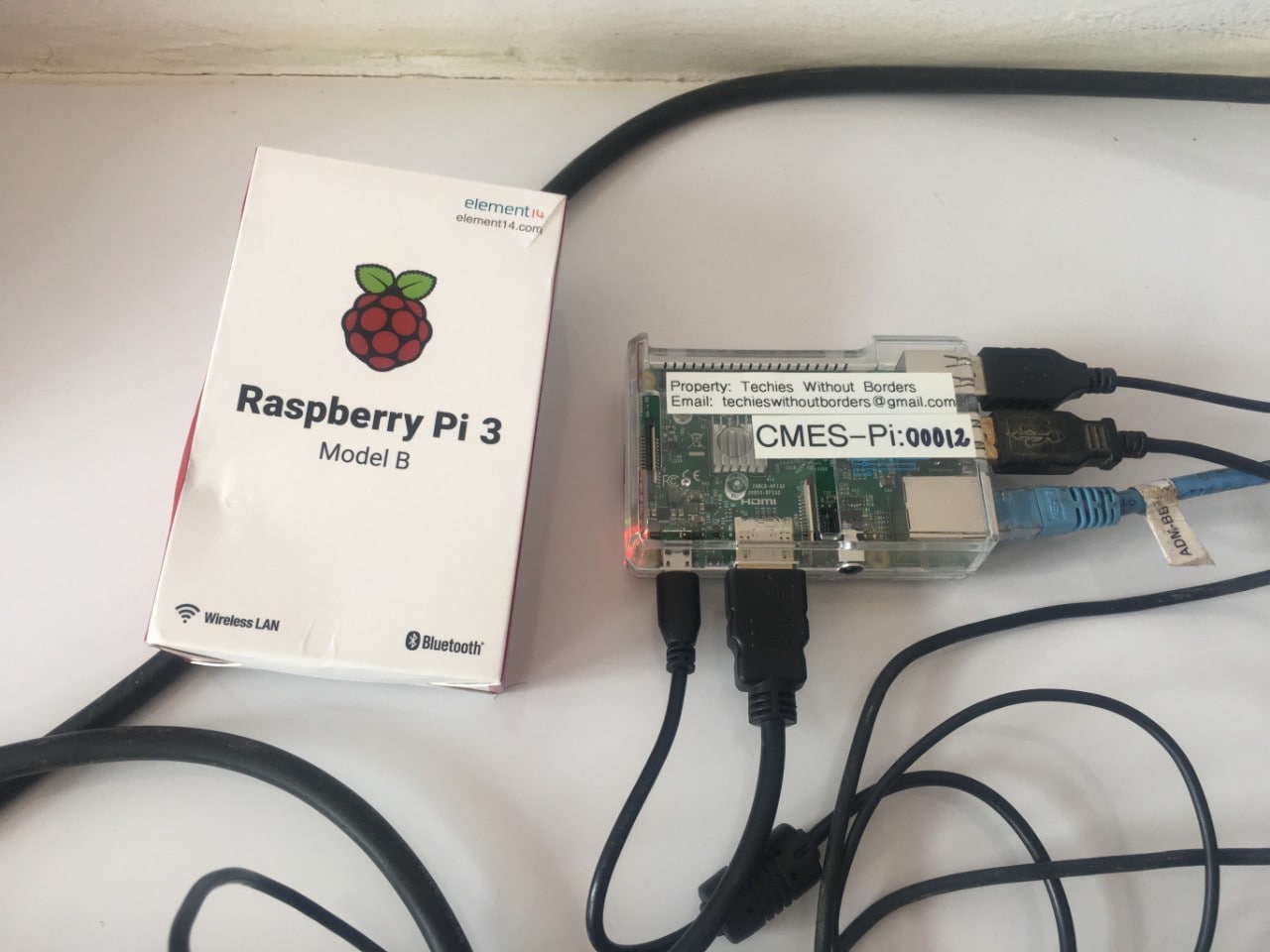 Photograph of a raspberry-pi device and its user manual