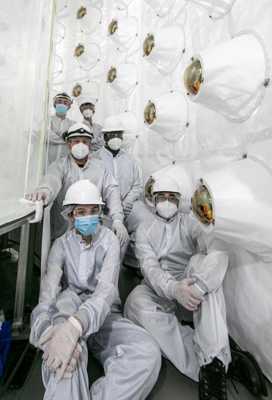 Researchers sit between two outer layers of LZ during construction.