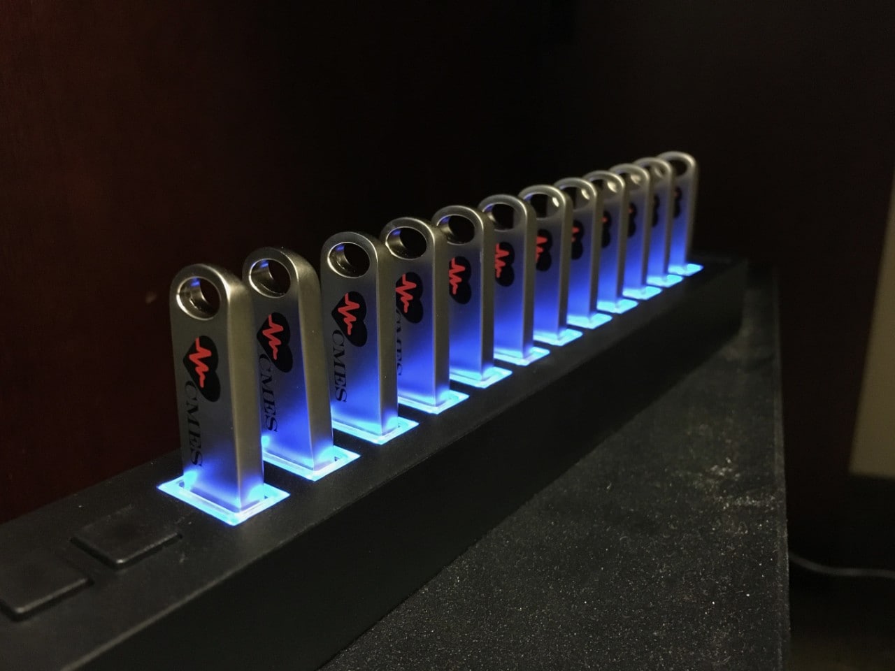 Photo of CMES USB devices all plugged in to a glowing hub.