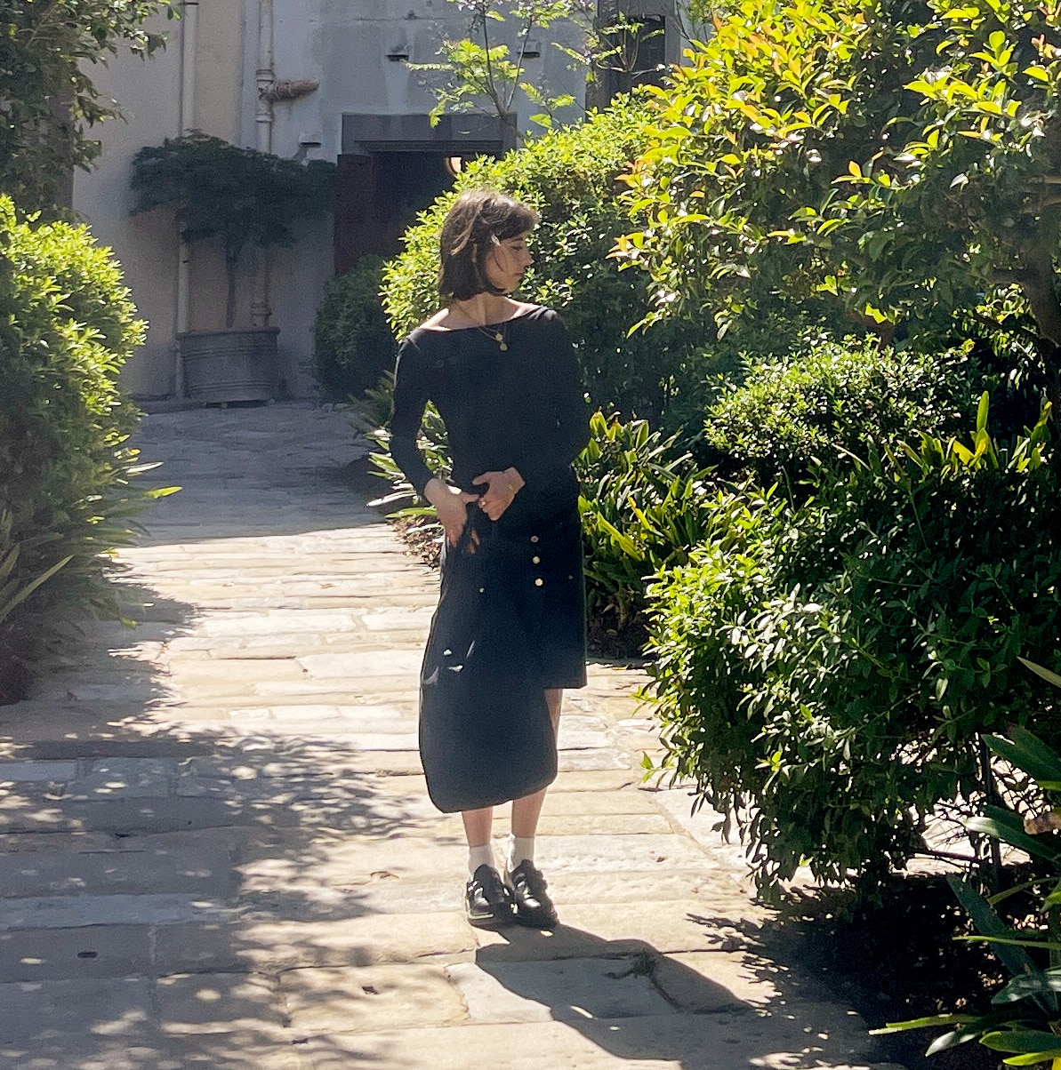 Maeve walking in the Vice-Chancellor's courtyard on campus at the University of Sydney.