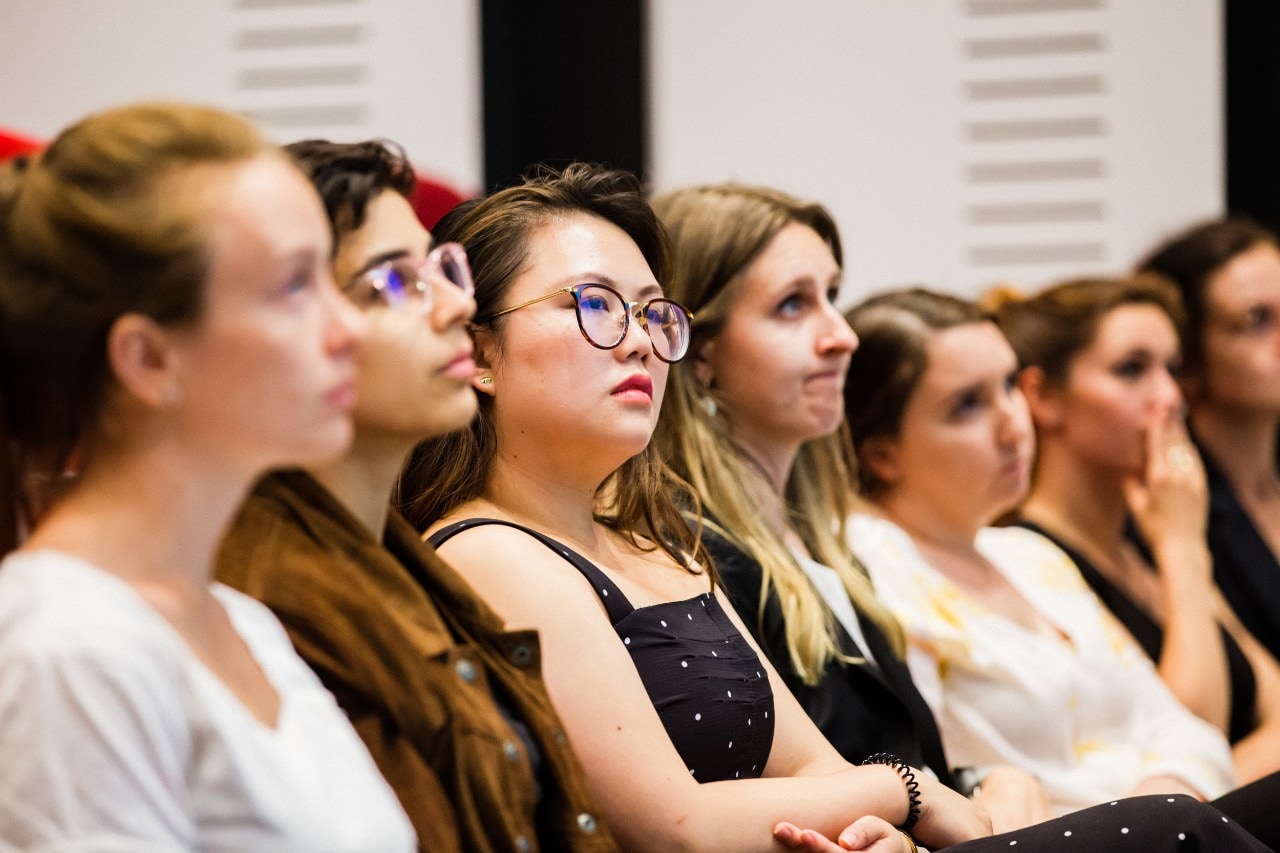 Young women in the audience at a Sydney Ideas event.