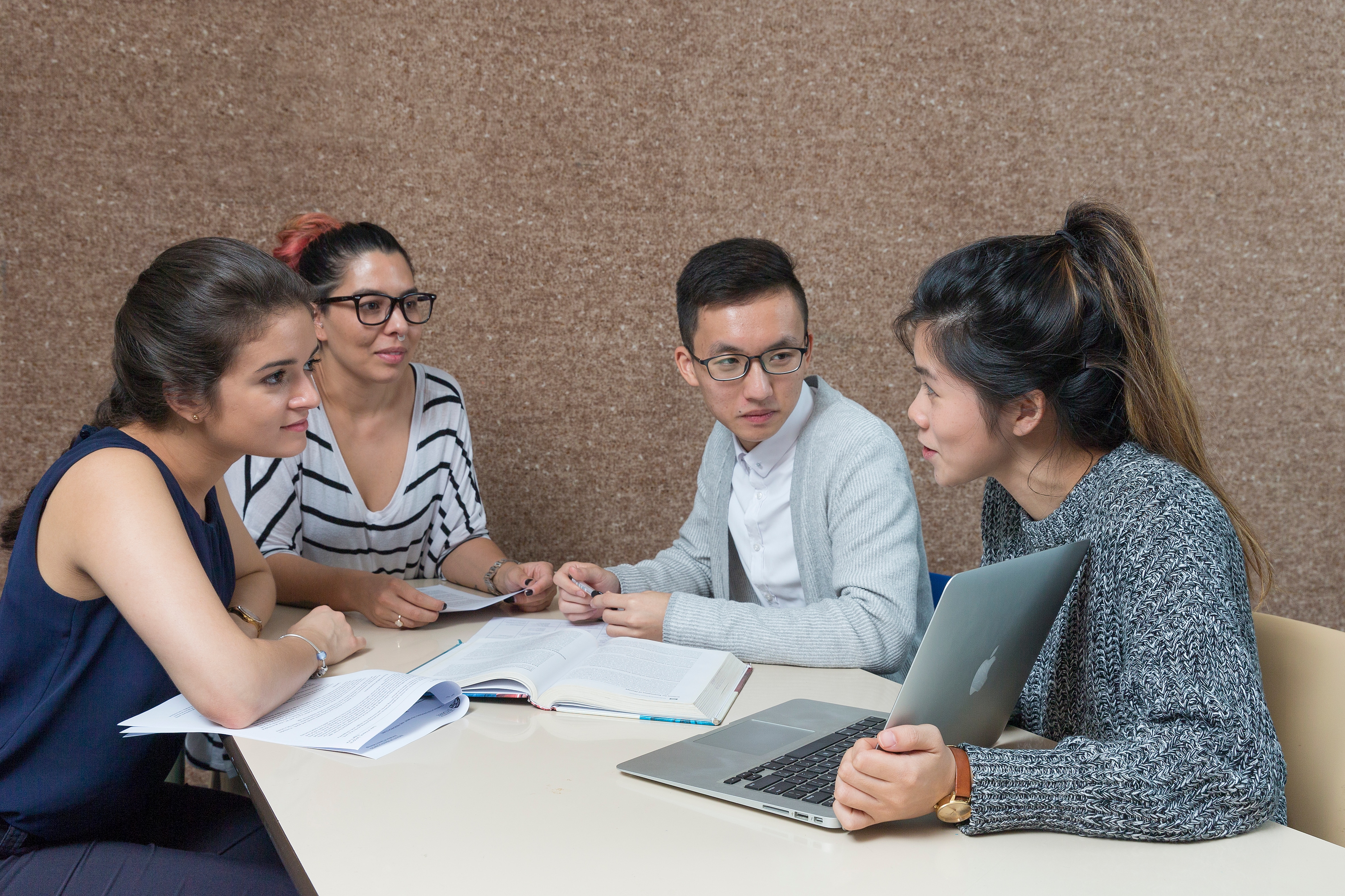 Fourth year Speech Pathology students: Longson Ng (male student in grey sweater);  Kristie Cham (grey jumper, cream pants); Antonia Chacon (dark blue top, brown plaited hair) Tara Takach (black and white striped top, pink bun).