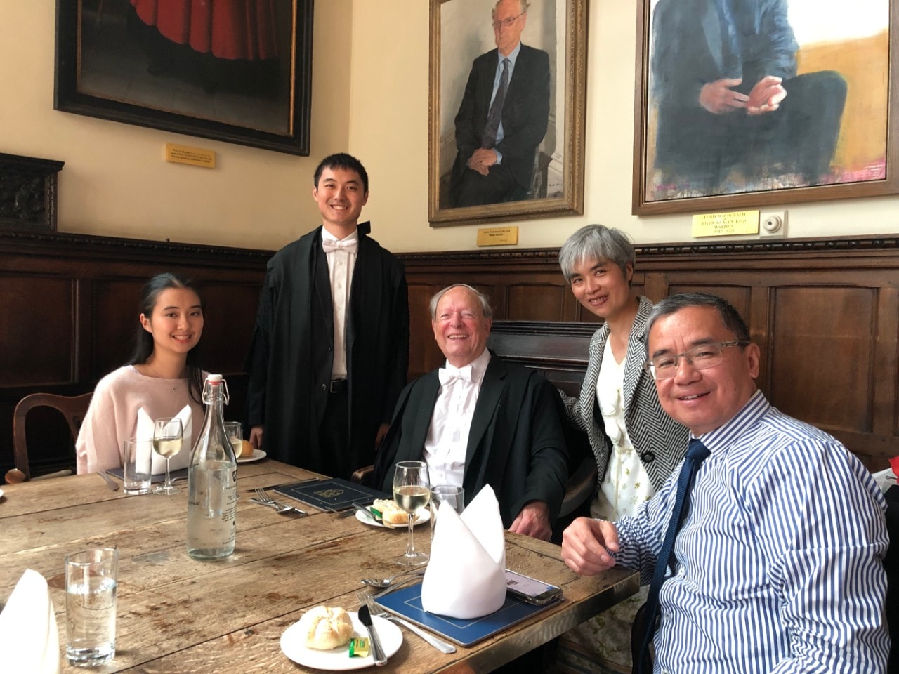 Dane Luo with a group of people at his Oxford Graduation