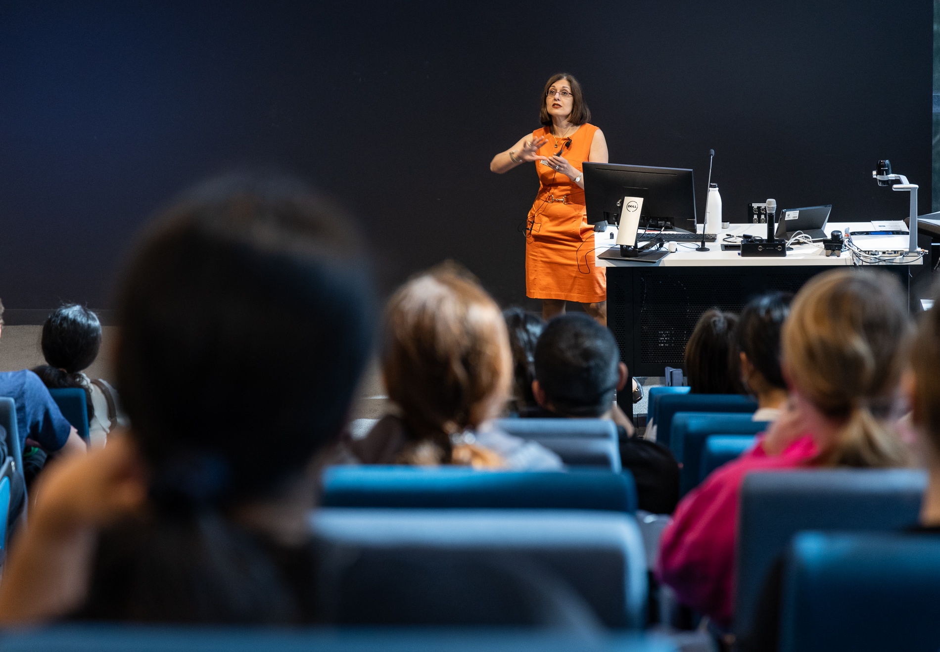 Academic giving a presentation in lecture theatre