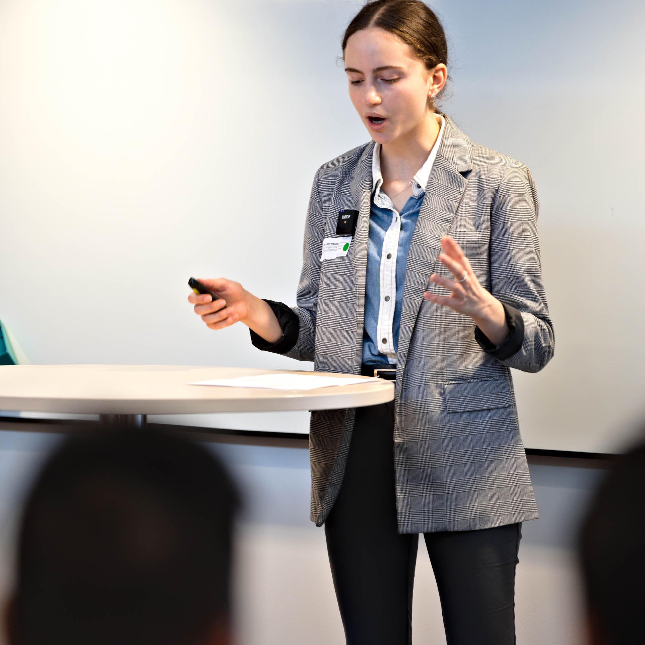 Danielle Haj-Moussa talking at a lectern