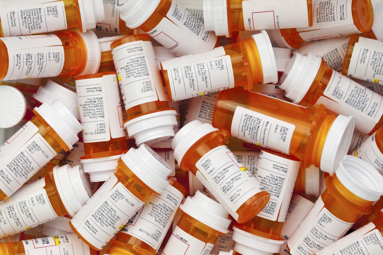 A large pile of containers for prescription drugs. 