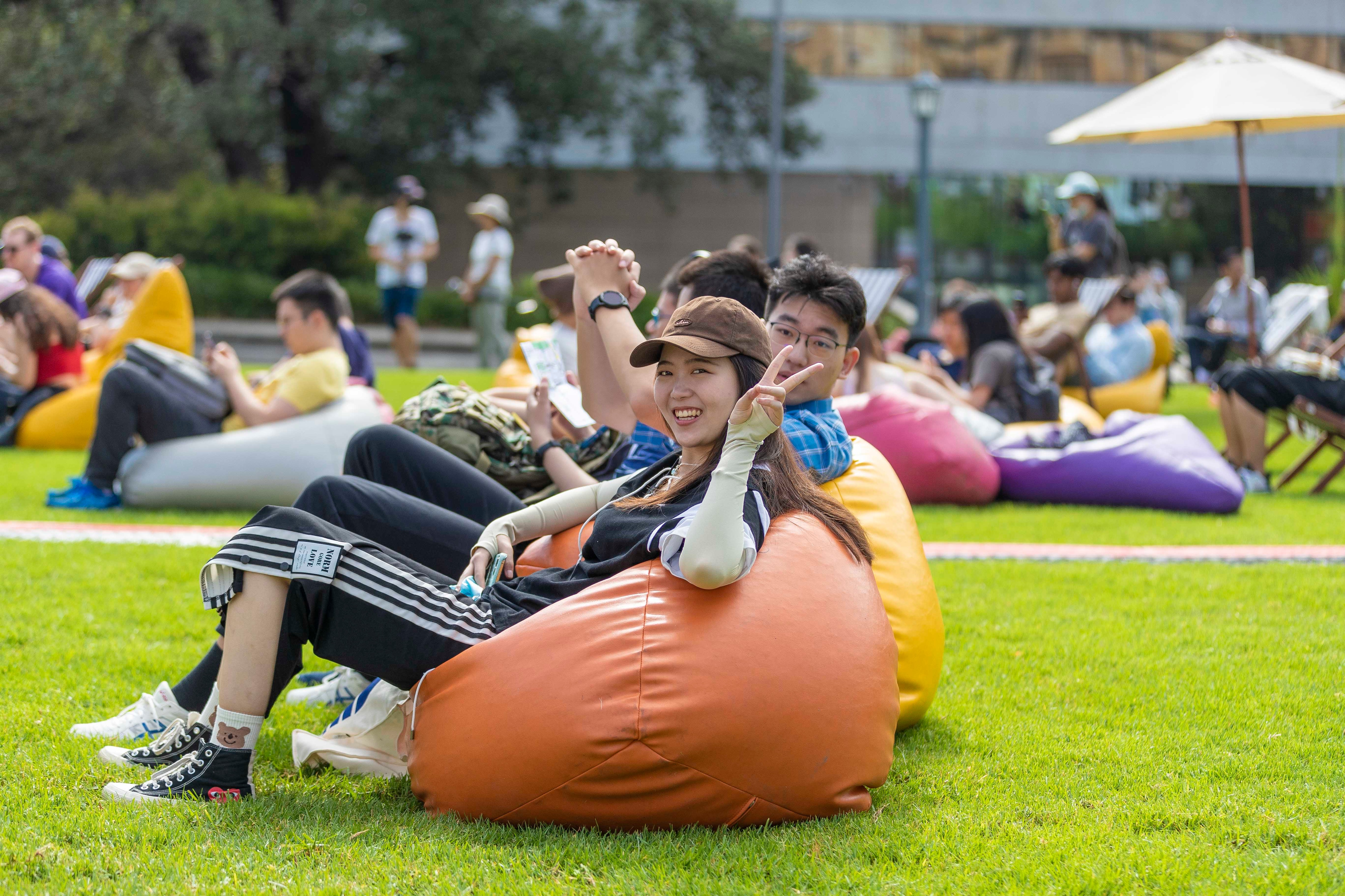 Students on beanbags on lawns