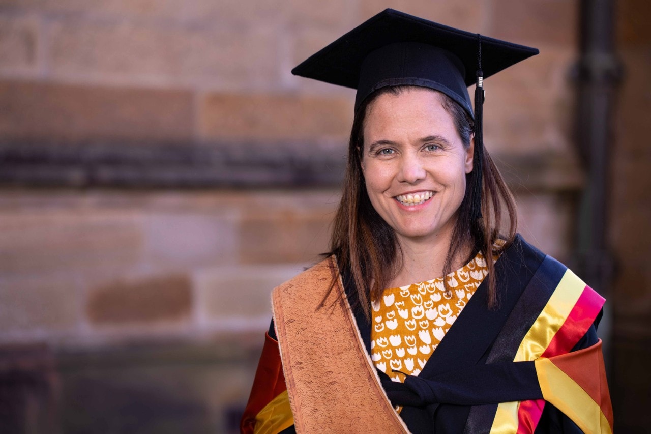 Katie Moore in graduation gown