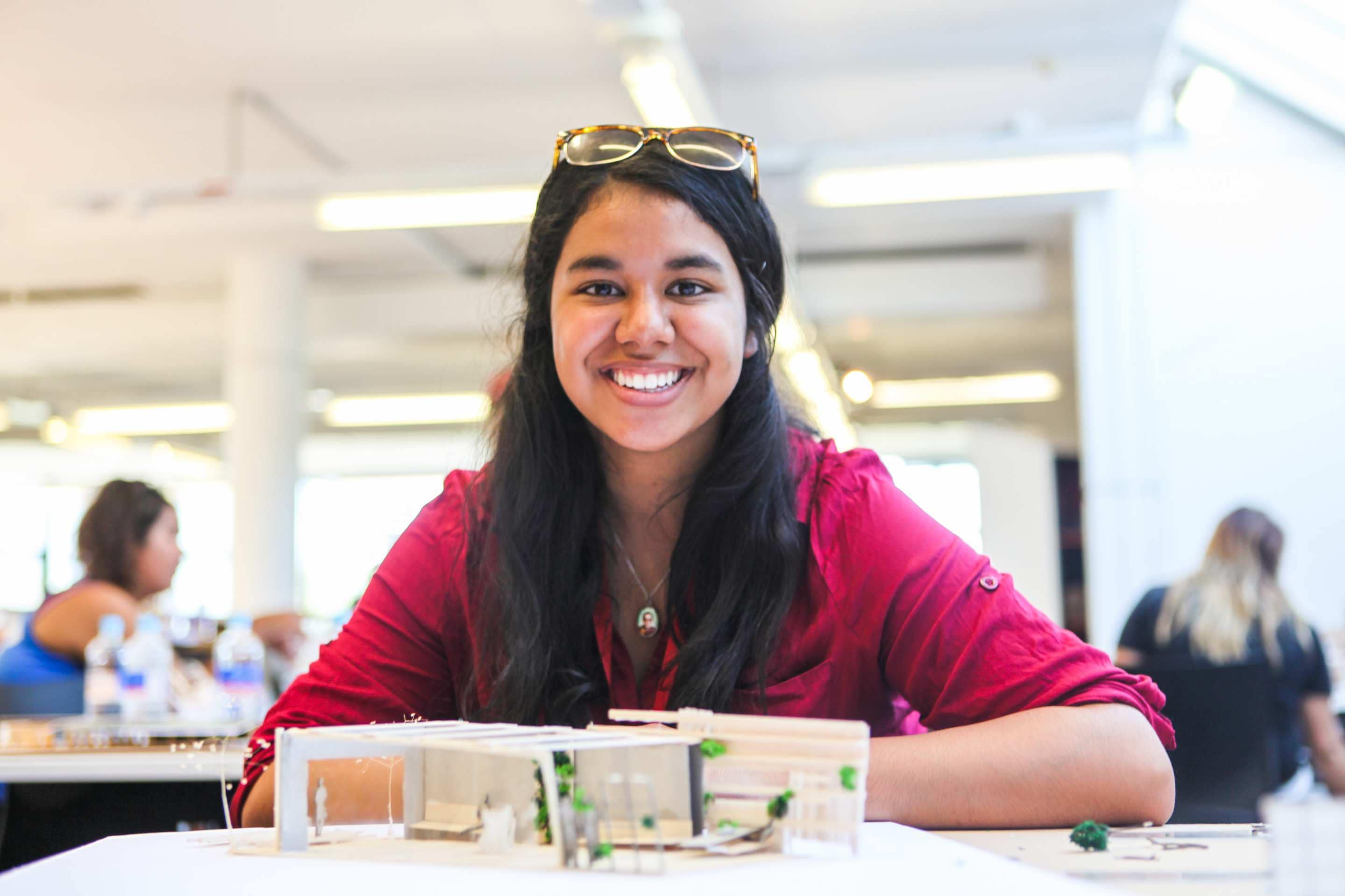 Architecture student with a building model