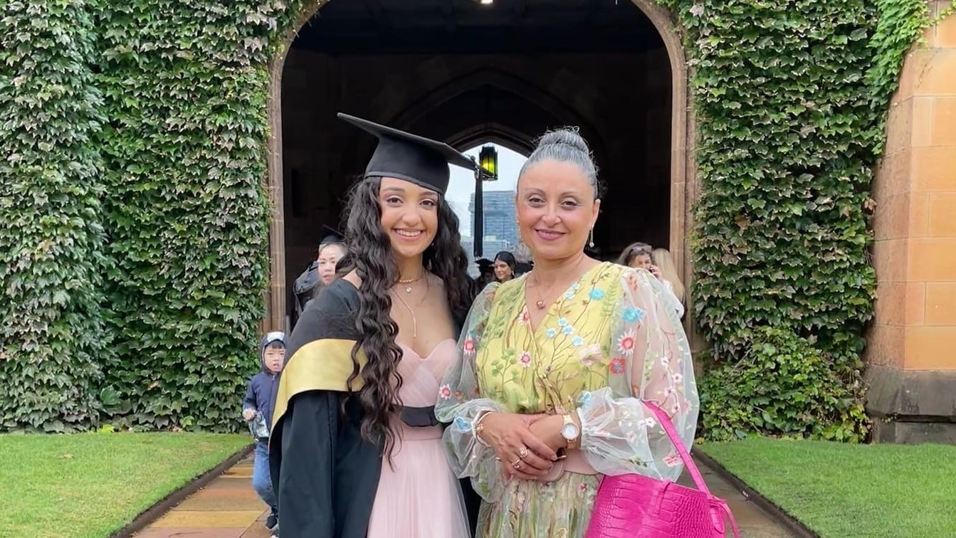 Piadora with her mother on her graduation day in the Main Quadrangle at the University of Sydney.