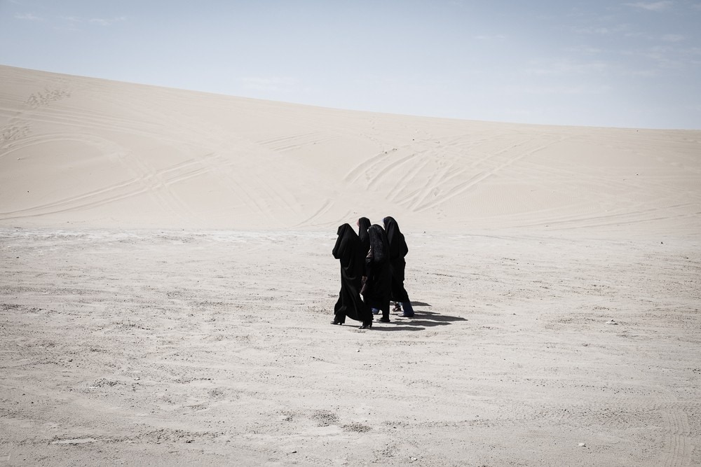Iranian women in desert landscape