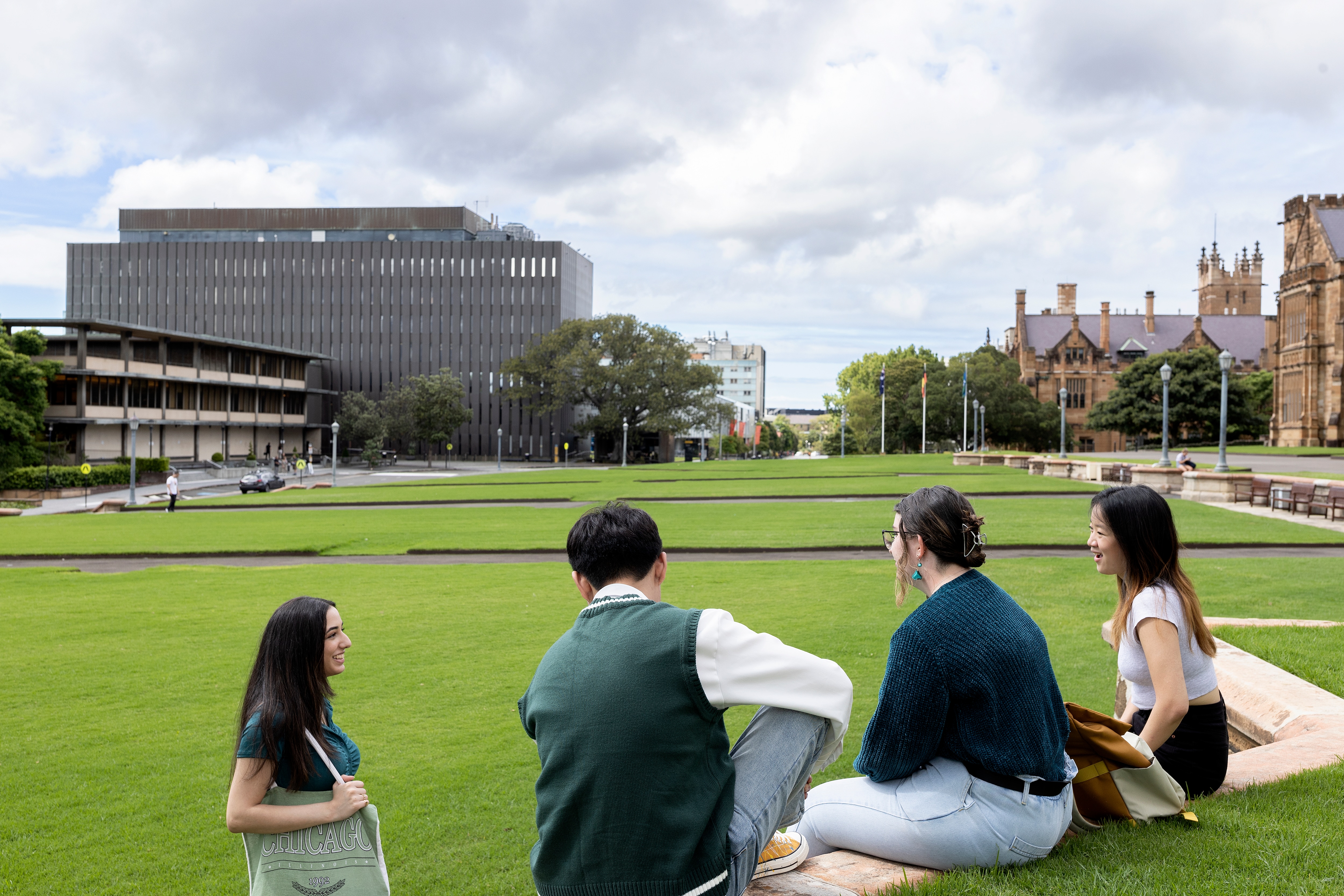 Students chatting on lawns out the front of the Quad