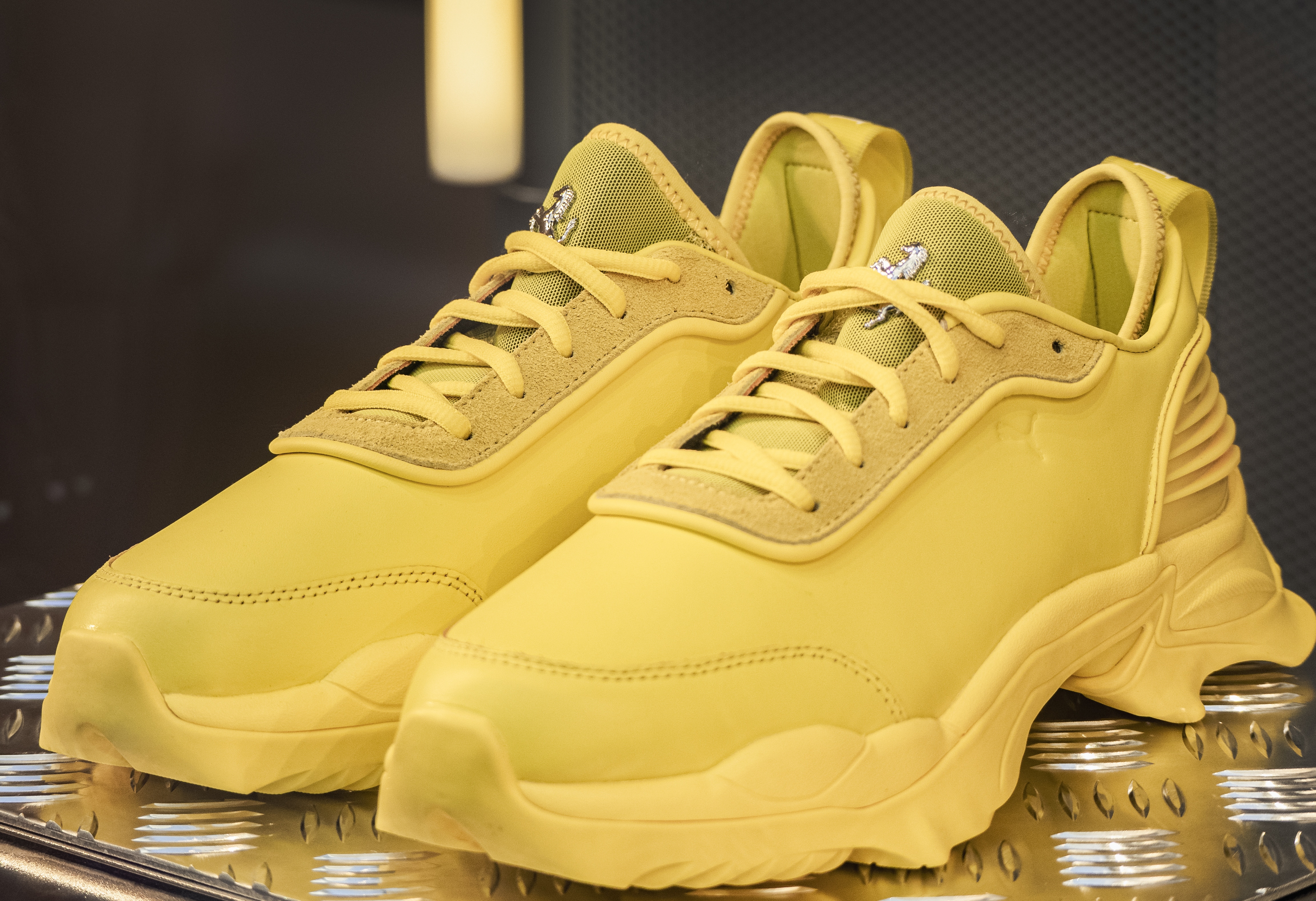 yellow motorsport sneakers by Puma for Scuderia Ferrari.Milan - Italy,06 May 2023