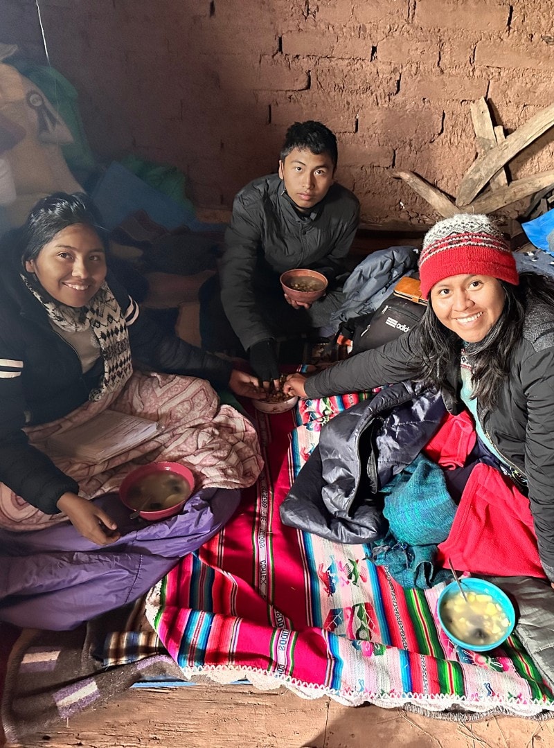 Evelyn (right) with her family in Bolivia.