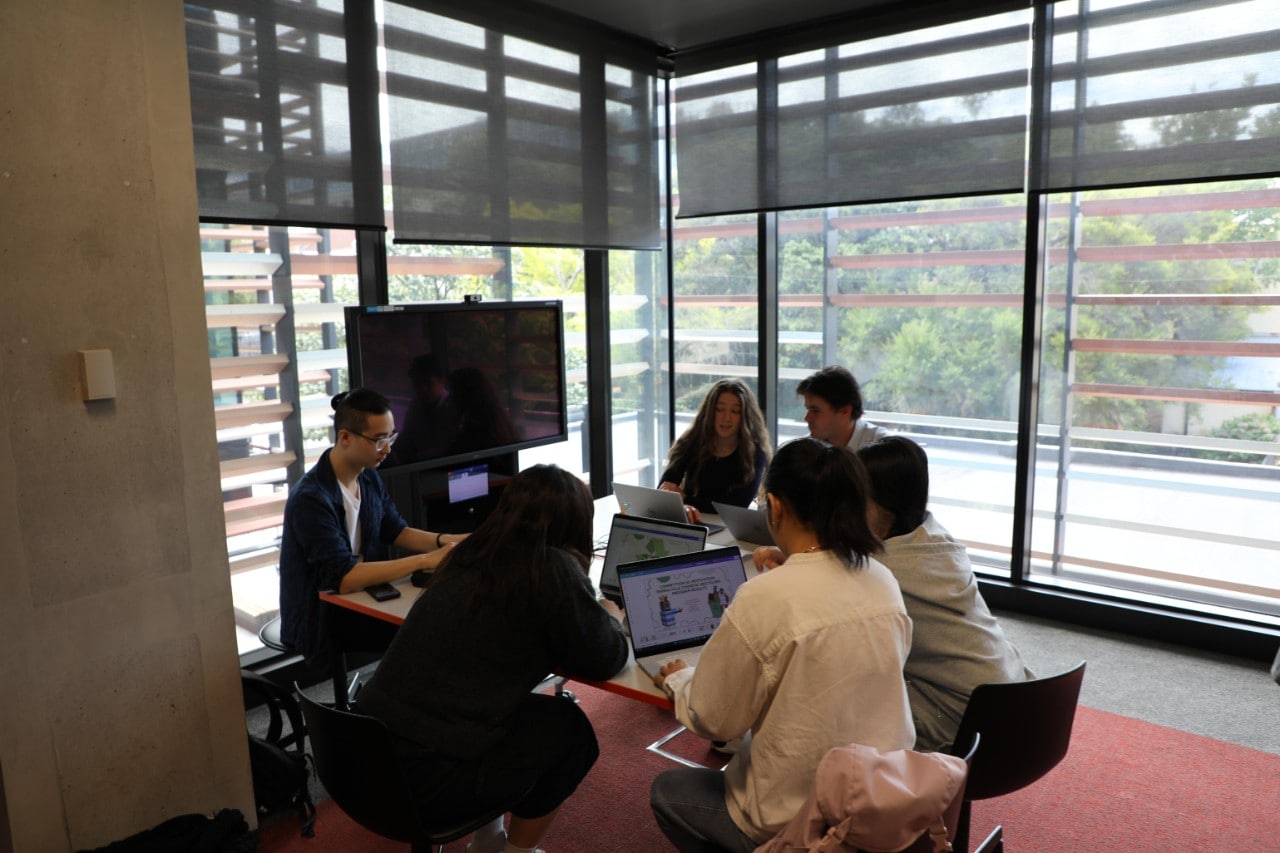 Students in a classroom sitting at a table